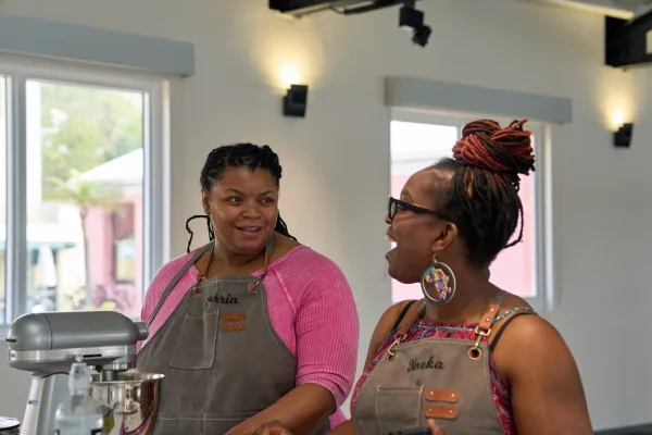 Two people participating in the Baker's retreat in Bermuda having a conversation