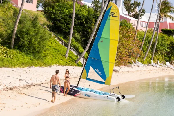 A couple posing with a boat