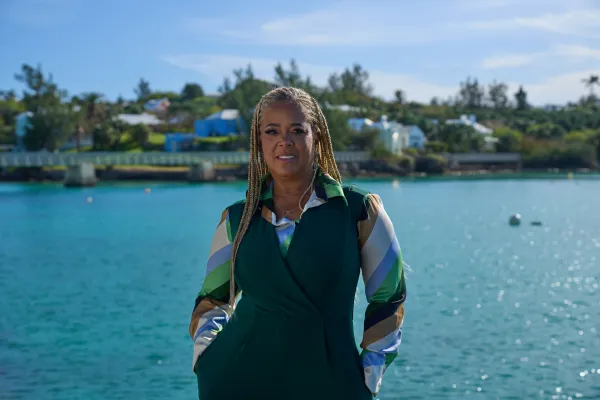 Suzette is standing on a dock.