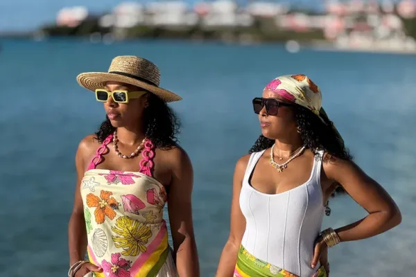 Two women wearing Courtney Clay Studio designed scarfs