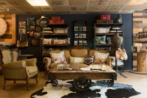 Sofa and table in middle of room on carpet