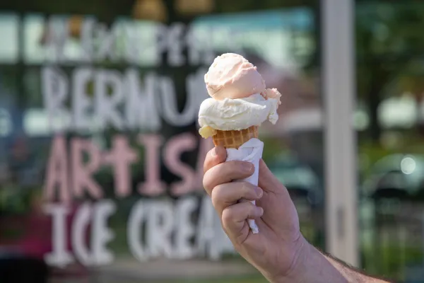 A close up of ice cream in front of a store.