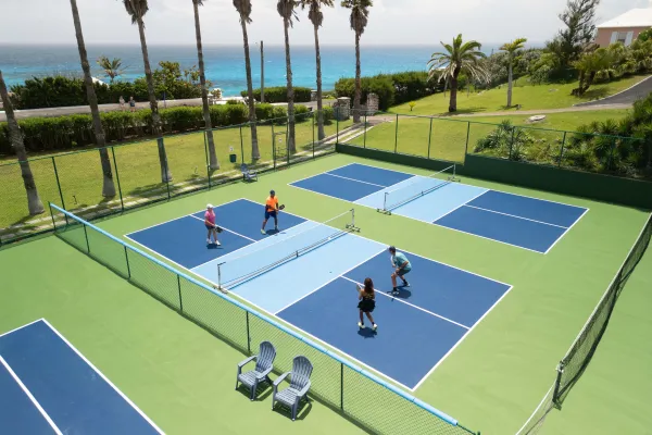 An aerial view of a group of people are playing pickleball.