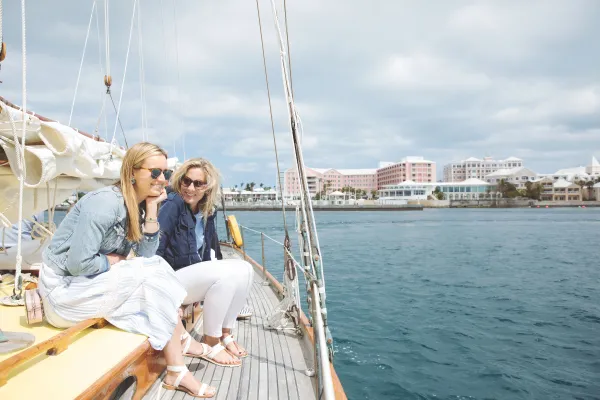 Two women are sitting on a boat.