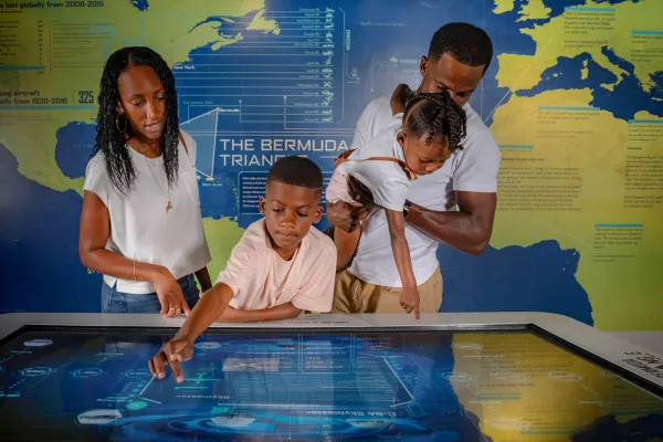 A family is posing at BUEI