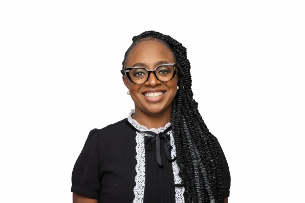 Davida O'Brien is smiling at the camera.