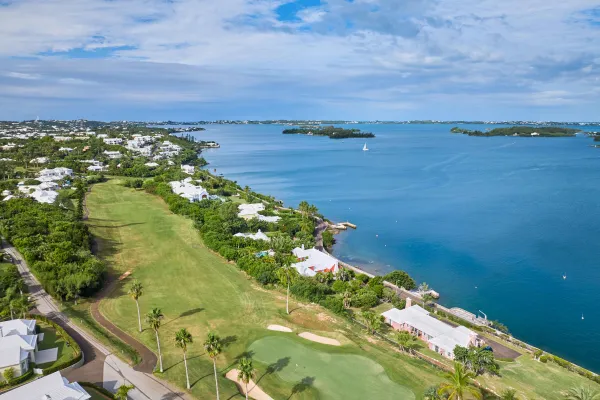 Aerial of newstead belmont hills with a sail boat floating by.