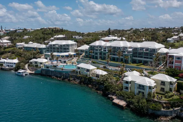 Aerial view of Newstead Belmont hotel with a lush greenery and a pool.