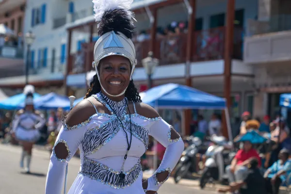A woman is a costume is smiling at Bermuda Day.