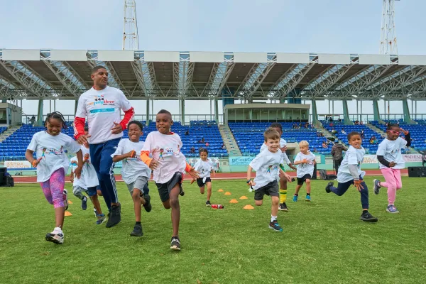 A group are running during the Kid's Clinic.
