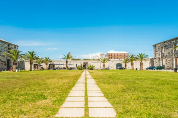 Stone pathway in the grass leading to a building