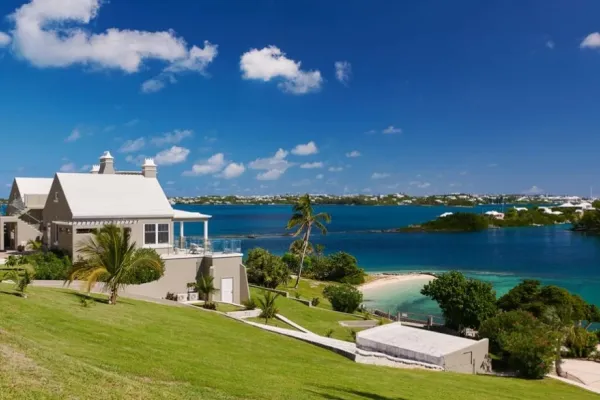 A building on a hill overlooking the water