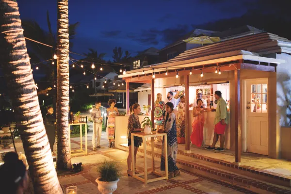 A group enjoying cocktails in Bermuda on an outdoor patio