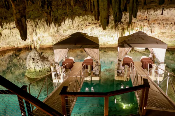 Spa massage beds on a floating dock in a cave in Bermuda