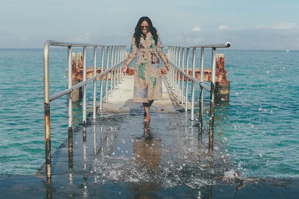 Woman walking on a wet dock