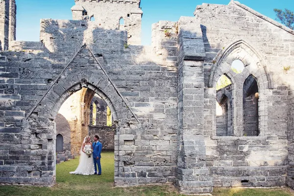 couple getting married in unfinished church
