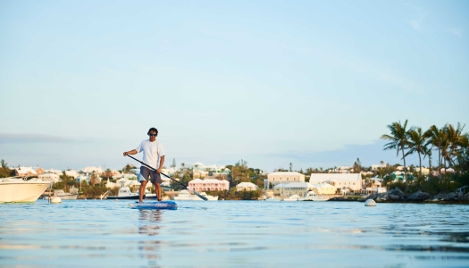 man paddle boarding