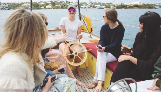 group of women laughing on a boat tour
