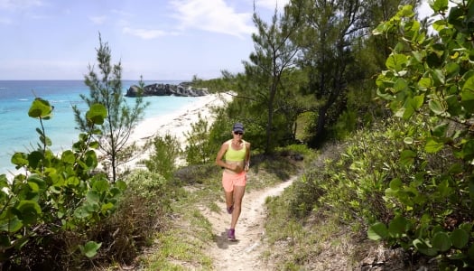 Flora Duffy running on a trail