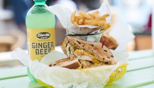 A fish sandwich the fries and ginger beer.