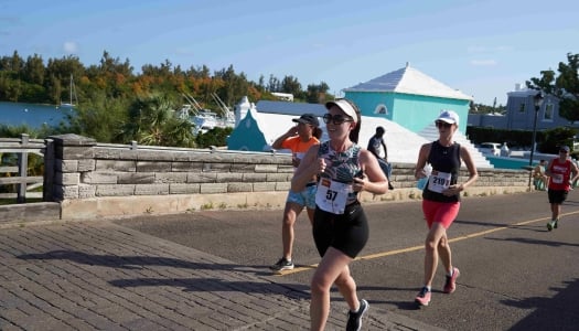 A group of people are running across Somerset bridge.