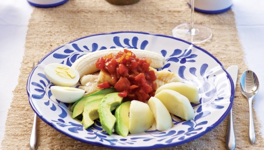 A traditional codfish breakfast with mimosas and colourful plate.