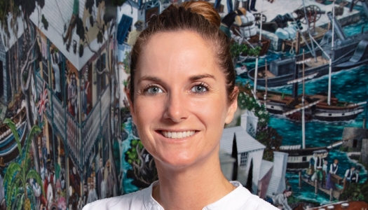 A woman is smiling at the camera.
