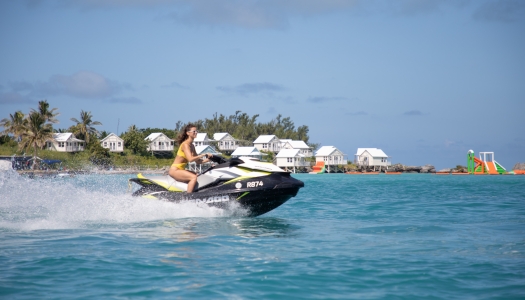 A woman is riding a jetski.