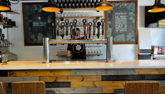 A woman is cleaning the beer taps in Bermuda Craft Brewery.