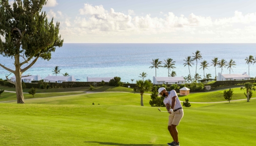 A man is playing on the golf course.