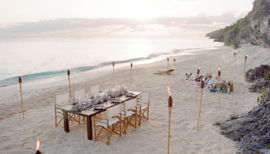 A beach set up of a dinner party.