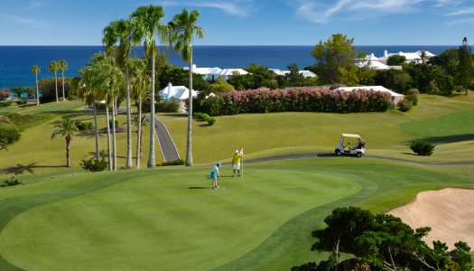 Two people are playing golf at Turtle Hill Golf Course.