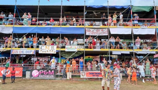 People are standing at colorful camps during Bermuda Cup Match.