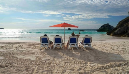 A group of friends are sitting on beach chairs at Horseshoe Bay