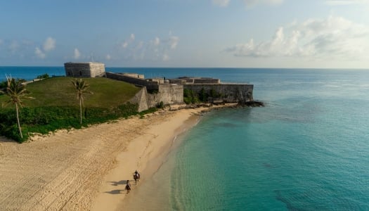 An aerial view of Fort St. Catheine with horsees on the beach.
