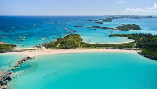 An aerial view of Cooper's Island with various beaches and Non Such Island