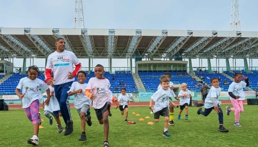 A group are running during the Kid's Clinic.