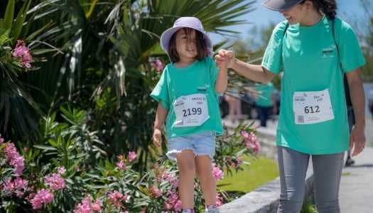 A little girl and her mom are walking during the Bermuda End to End.