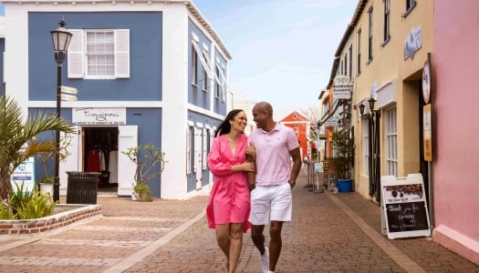 A couple is walking down waterstreet.