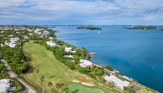 Aerial of newstead belmont hills with a sail boat floating by.