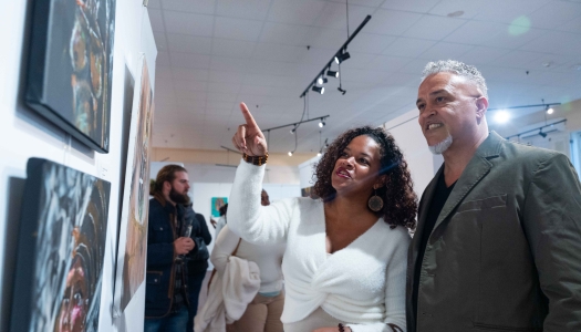 A couple are experiencing an art gallery.
