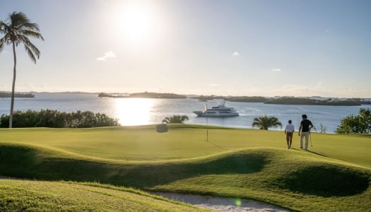 An aerial view of a dad & son playing golf