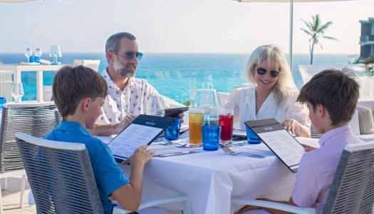 A family is eating dinner outside.