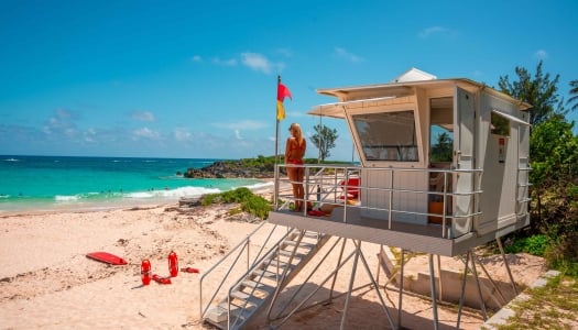 A life guard is standing at John Smith Bay