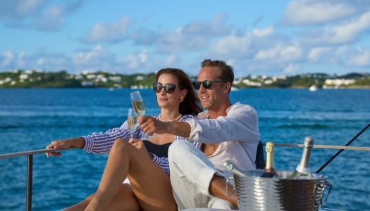 A couple is posing on a yacht.