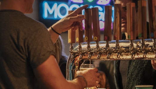 A close up of beer on a tap.