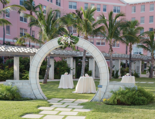 A moongate with a wedding setup in the Hamilton Princess courtyard 