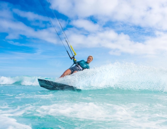 woman kite surfing at Horseshoe Bay