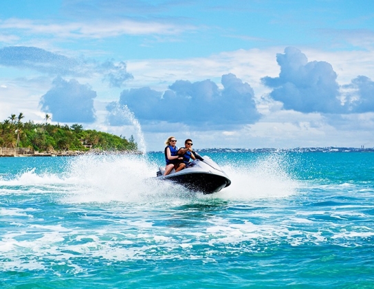 2 people on a jet ski in the ocean