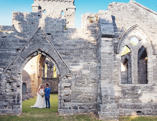 couple getting married in unfinished church